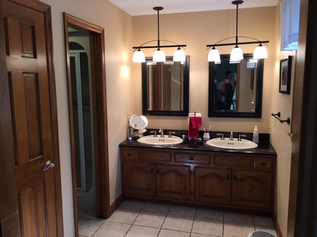 bathroom cabinets before bath remodel 