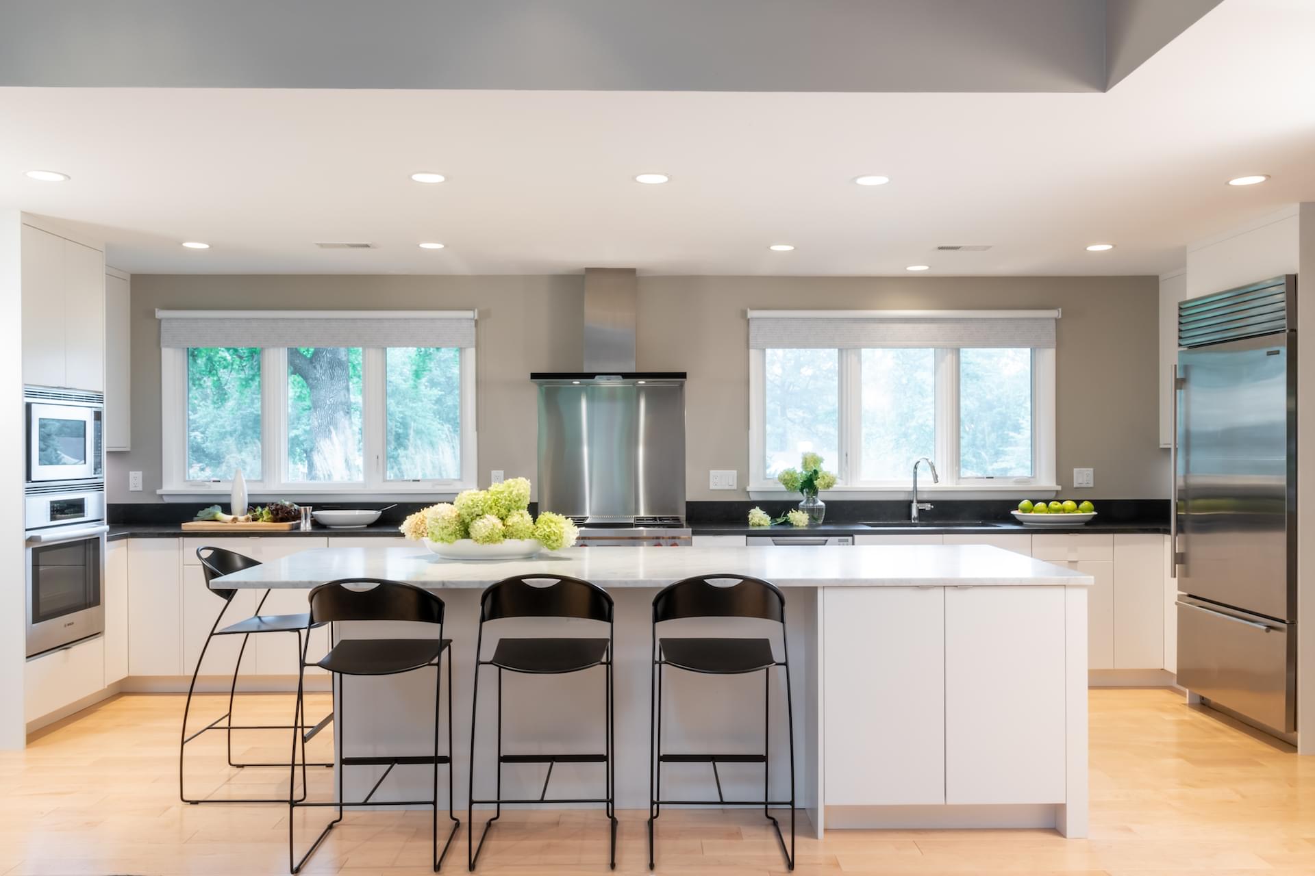 image of kitchen with a white island in the center